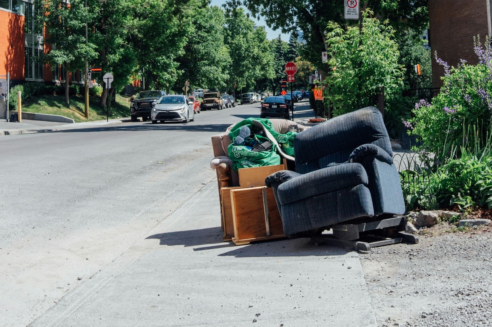 Worn armchair left at the curb for furniture pickup