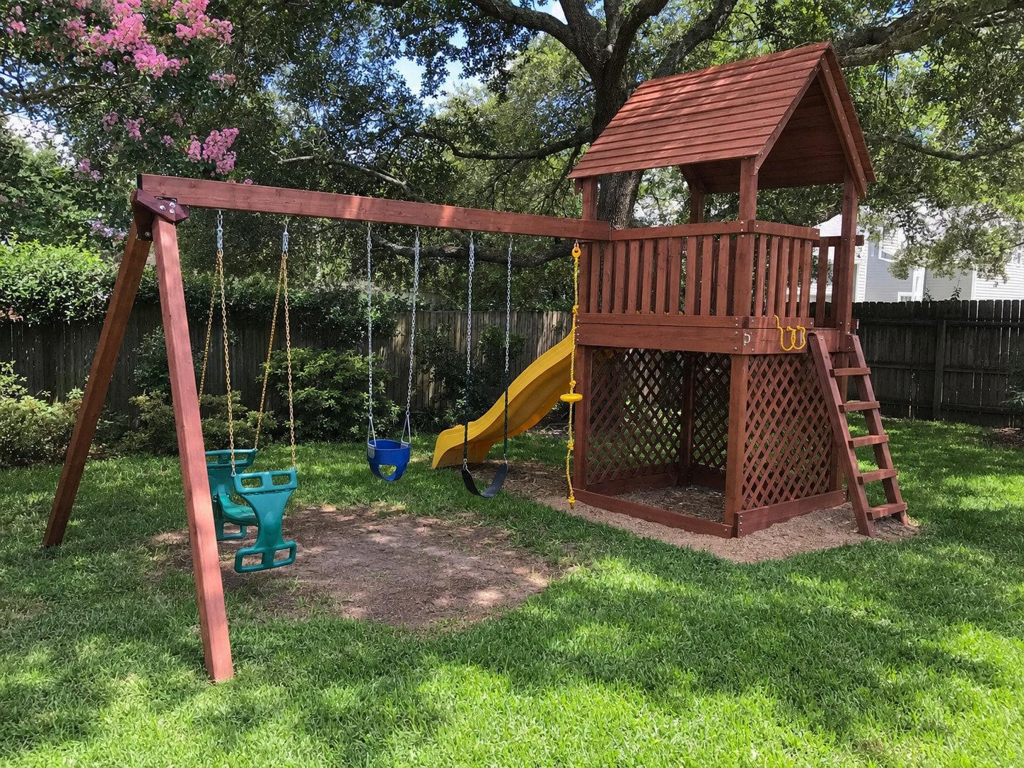 Wooden backyard playset before teardown